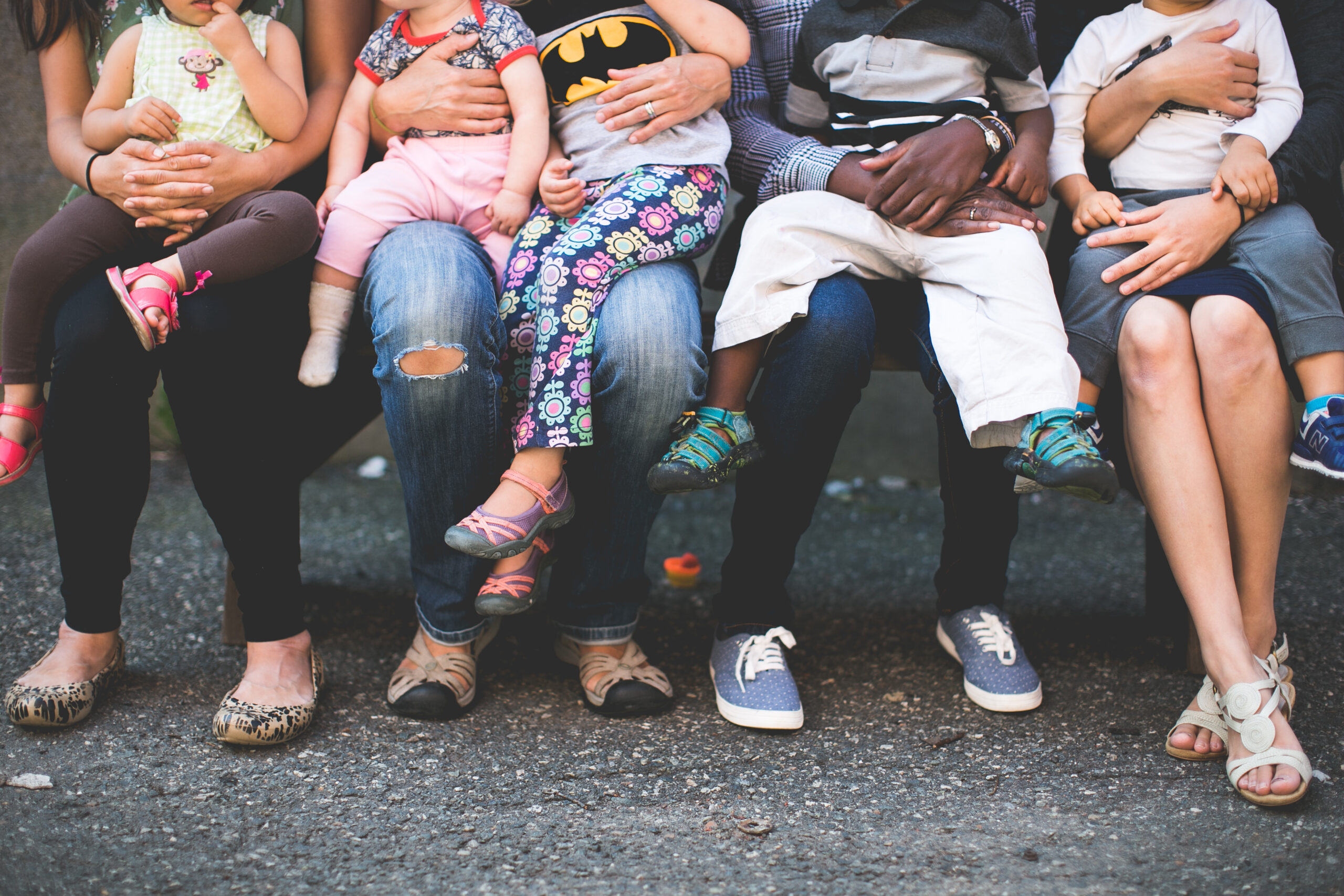 cute photo of a bunch of kids sitting on their moms laps