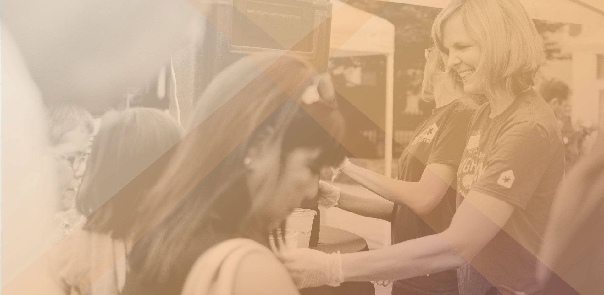 Woman serving drinks to people in line